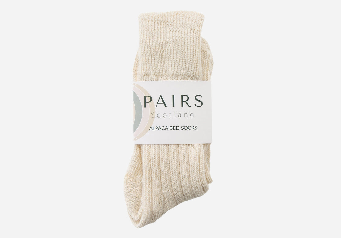 natural undyed cream white alpaca wool socks in brand packaging