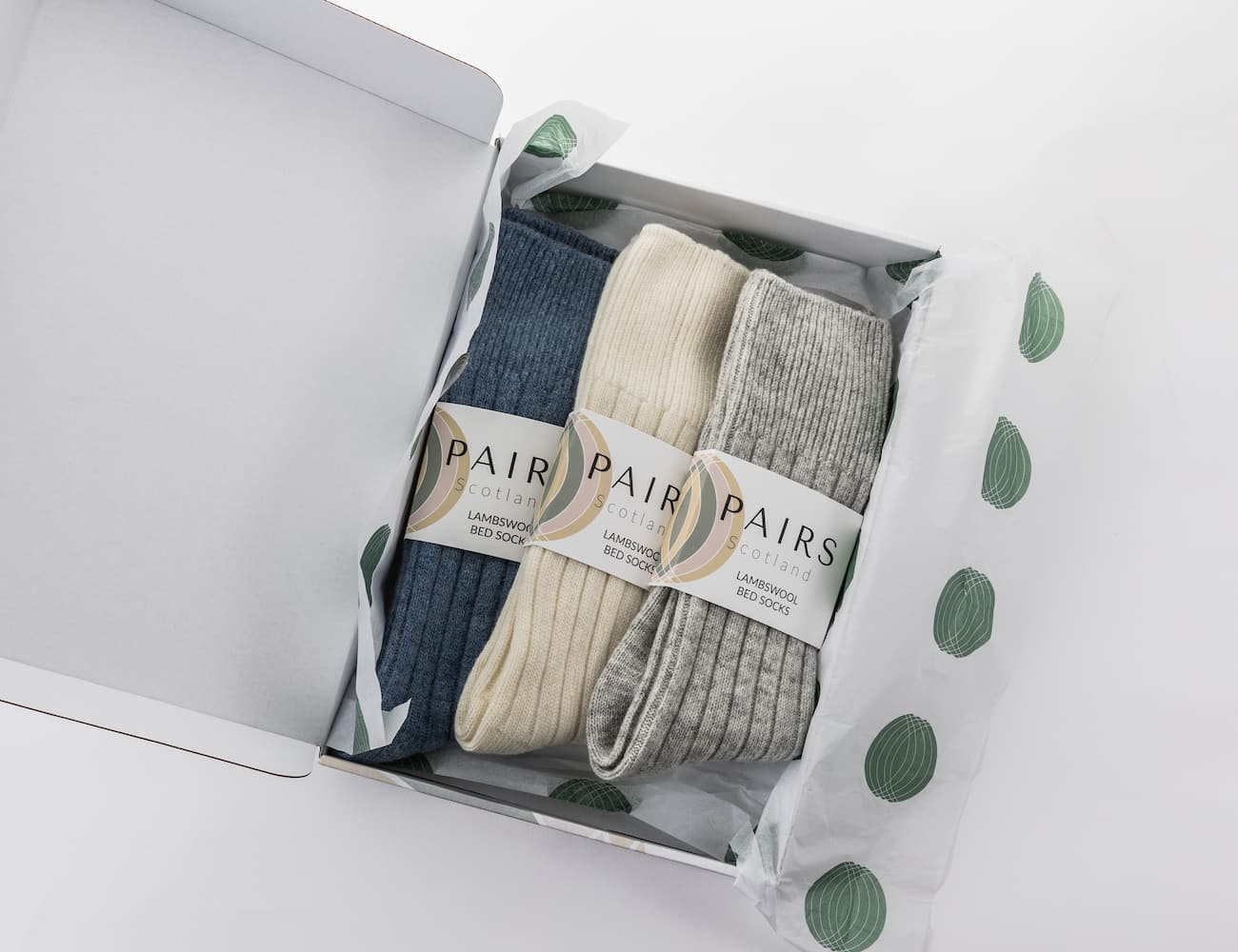 lambswool bed socks blue cream and green and a box