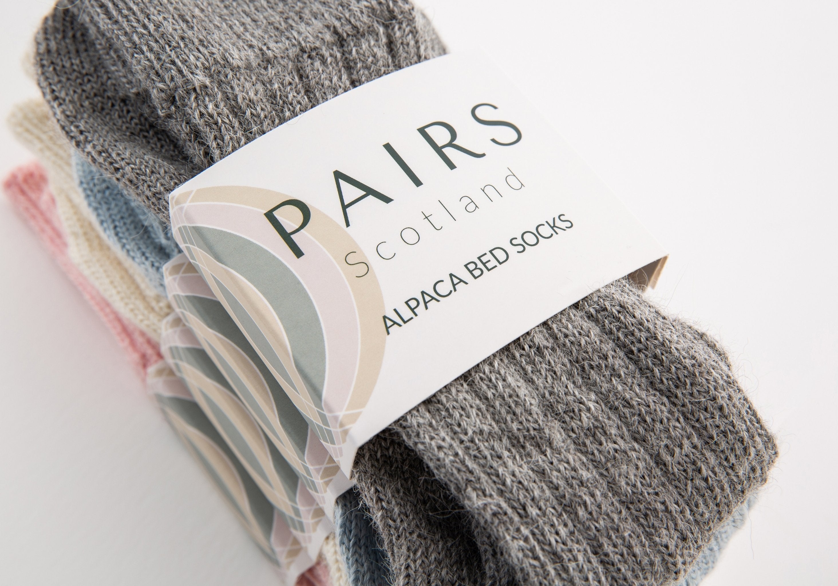 alpaca wool bed soft men and women sock range in soft hues, four pairs piled up