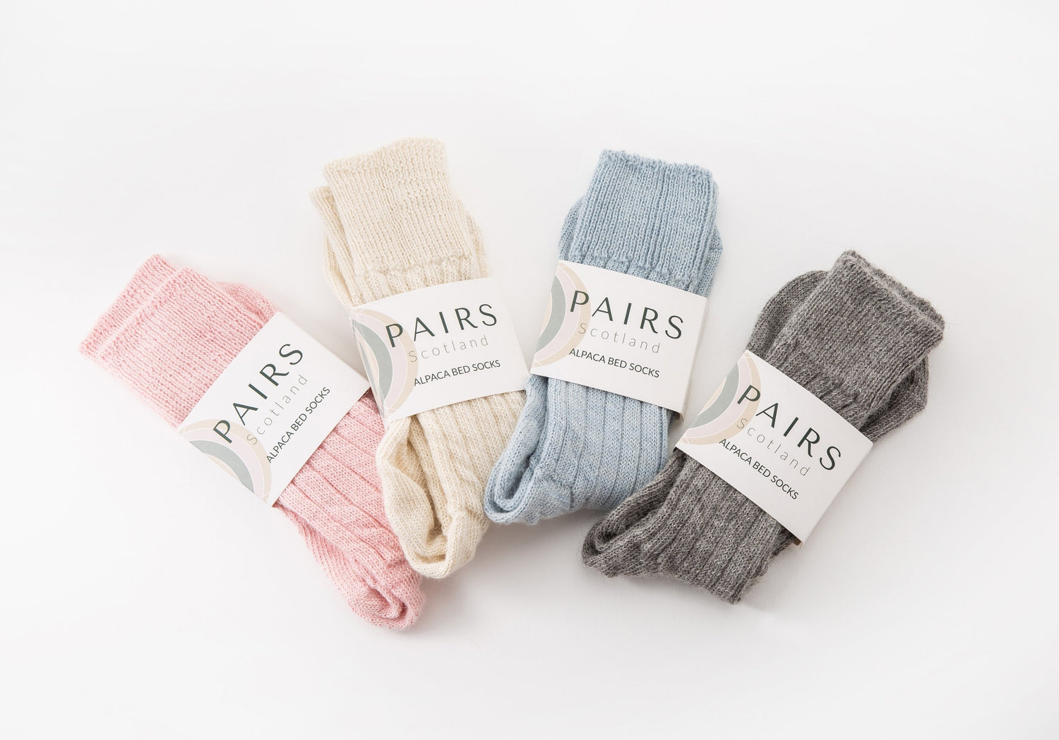 alpaca wool bed soft men and women sock range in soft hues, four pairs piled up