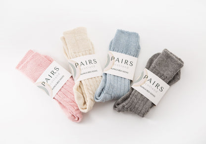 alpaca wool bed soft men and women sock range in soft hues, four pairs piled up