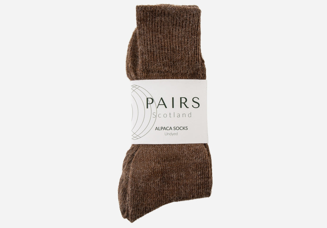 natural undyed brown alpaca wool socks in brand packaging